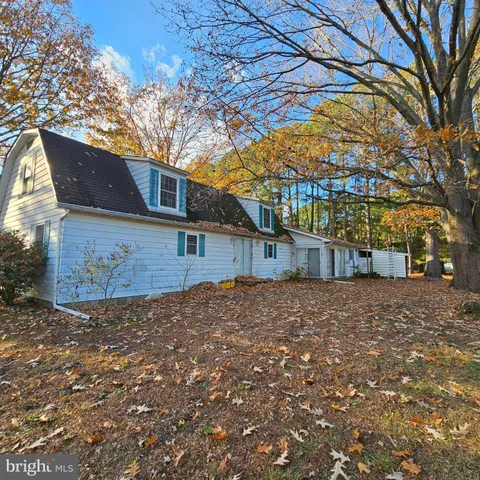 a house view with a backyard space