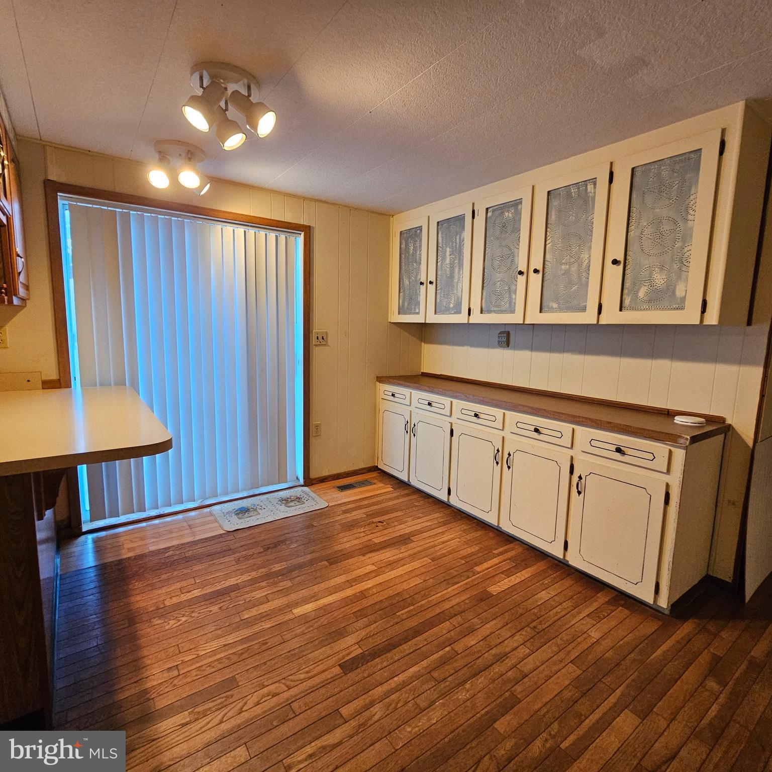 8210 Ingleton Circle Easton, MD 21601 - Photo 6 of 13 a view of a kitchen with furniture wooden floor and window