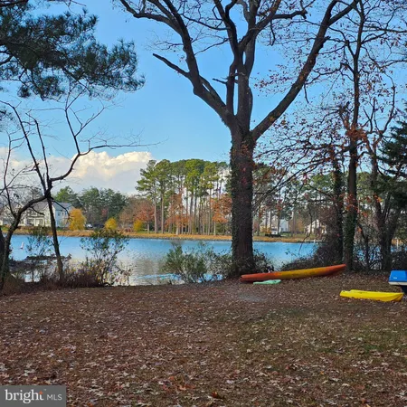 a view of a yard with swimming pool