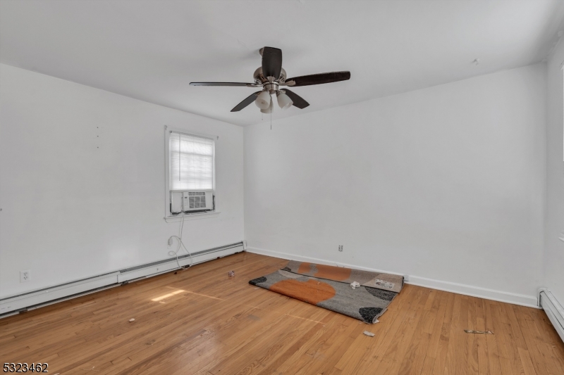 2801 Dewitt Terrace Linden, NJ 07036 - Photo 11 of 23 wooden floor in an empty room with a window