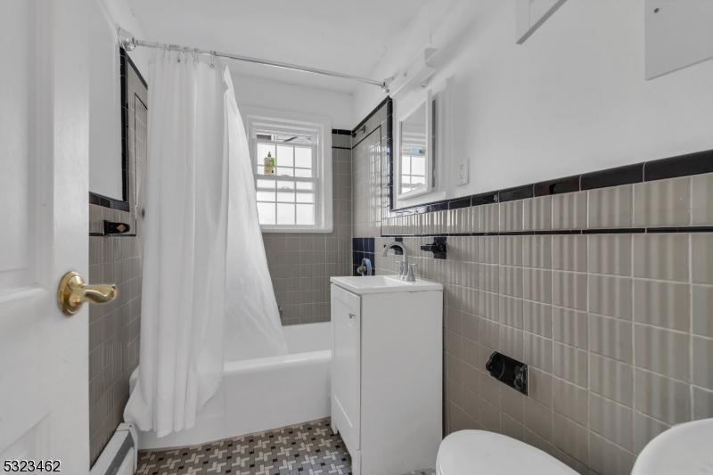 2801 Dewitt Terrace Linden, NJ 07036 - Photo 14 of 23 a bathroom with a sink toilet and shower