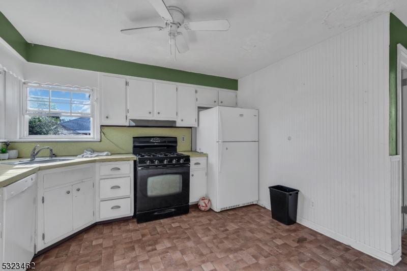 2801 Dewitt Terrace Linden, NJ 07036 - Photo 2 of 23 a kitchen with white cabinets and white appliances