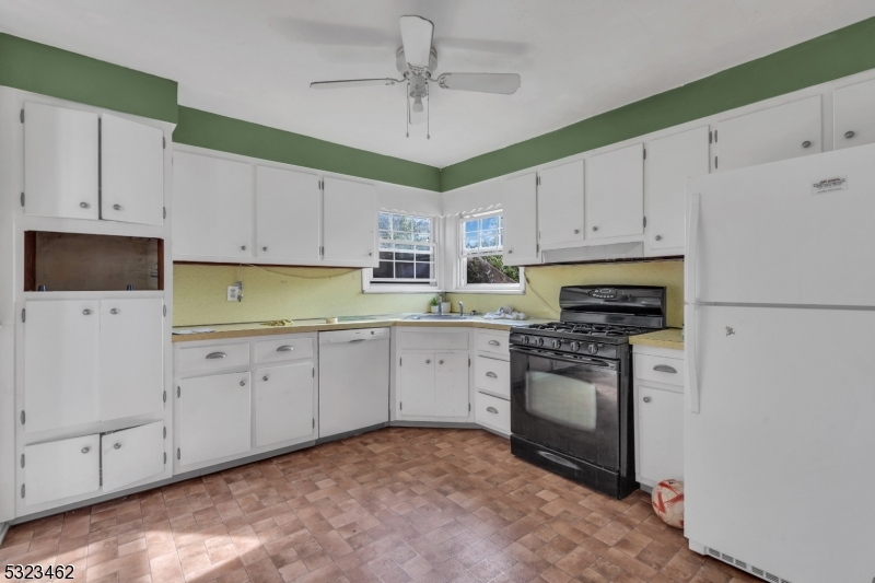 2801 Dewitt Terrace Linden, NJ 07036 - Photo 3 of 23 a kitchen with cabinets stainless steel appliances and a counter space