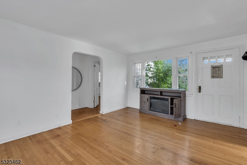 2801 Dewitt Terrace Linden, NJ 07036 - Photo 8 of 23 a view of empty room with wooden floor and fan