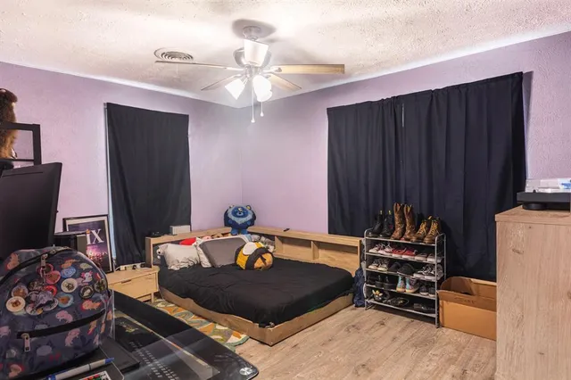 a room with furniture and wooden floor