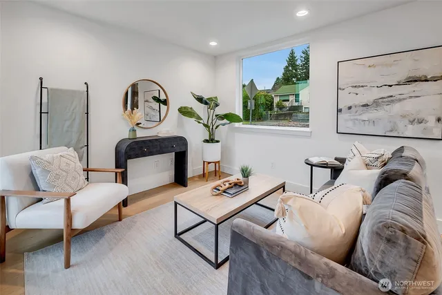 a living room with furniture and wooden floor