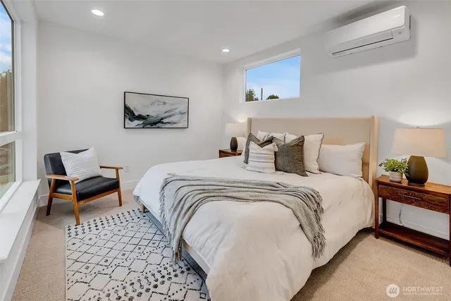 a bedroom with a bed and a chair