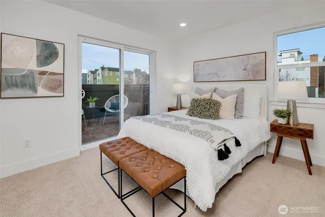 a bedroom with a bed and window