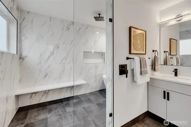 a bathroom with a sink and mirror
