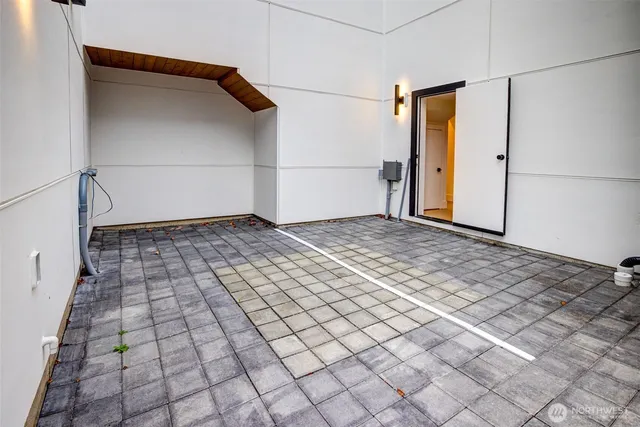 a view of a utility room with cabinets