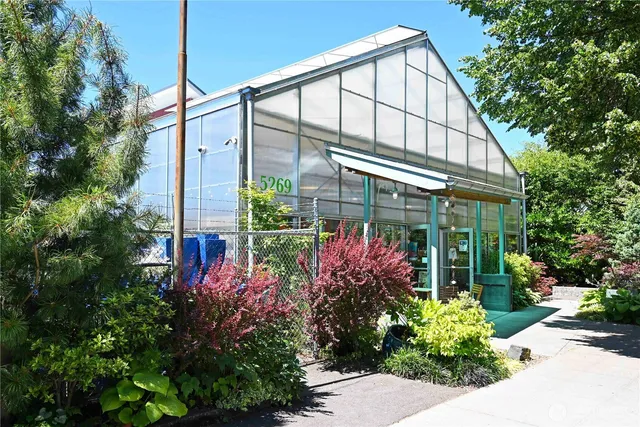 a front view of a building with parking space