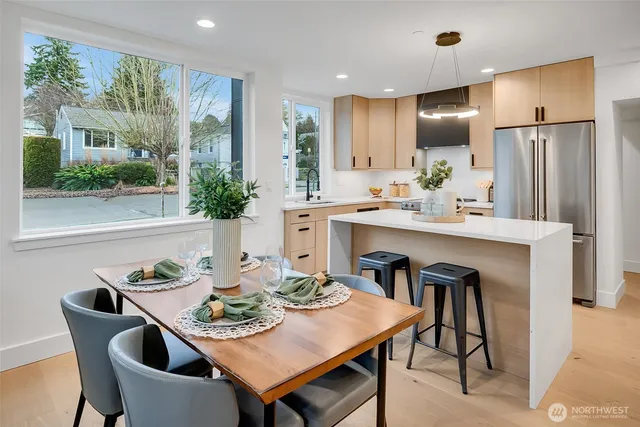a view of a dining room with furniture window and outside view