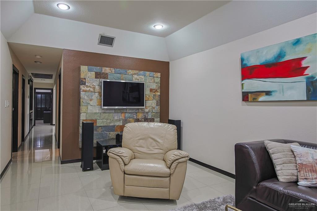 412 Toronto Avenue, Unit 34 McAllen, TX 78503 - Photo 15 of 44 Living area featuring light tile patterned flooring and baseboards