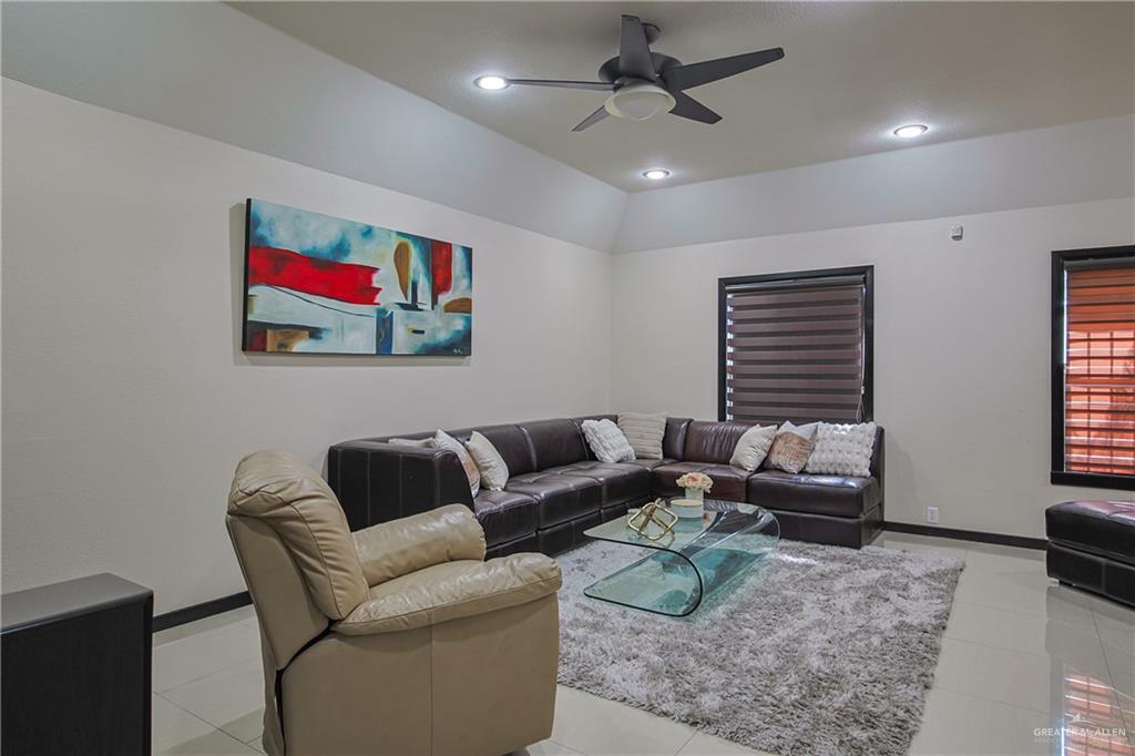 412 Toronto Avenue, Unit 34 McAllen, TX 78503 - Photo 16 of 44 Living area featuring light tile patterned floors, recessed lighting, lofted ceiling, and ceiling fan
