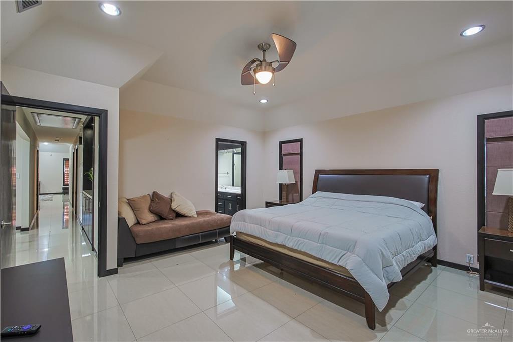 412 Toronto Avenue, Unit 34 McAllen, TX 78503 - Photo 18 of 44 Bedroom with light tile patterned flooring, recessed lighting, attic access, a ceiling fan, and ensuite bathroom