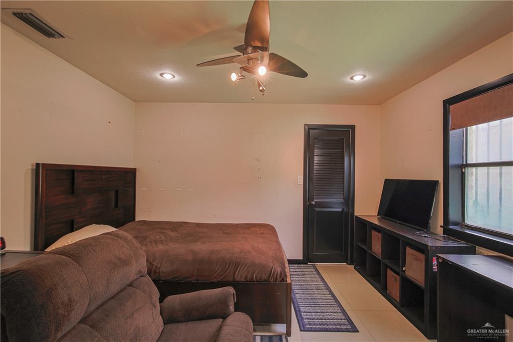 412 Toronto Avenue, Unit 34 McAllen, TX 78503 - Photo 31 of 44 Bedroom featuring light tile patterned floors, ceiling fan, and recessed lighting
