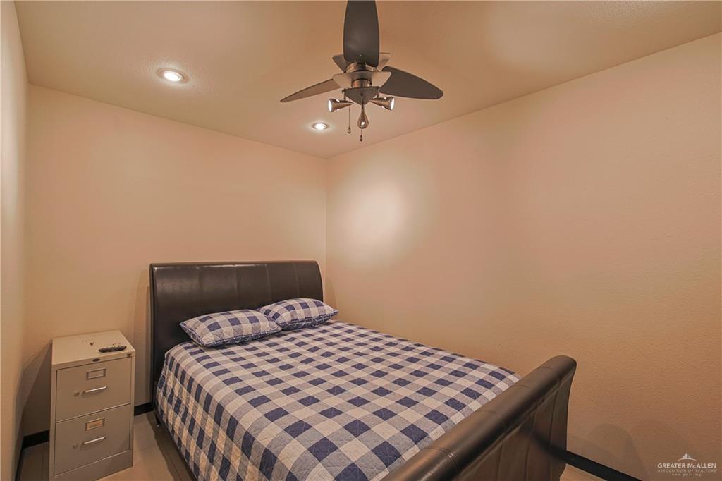412 Toronto Avenue, Unit 34 McAllen, TX 78503 - Photo 32 of 44 Bedroom with a ceiling fan, recessed lighting, and light tile patterned floors