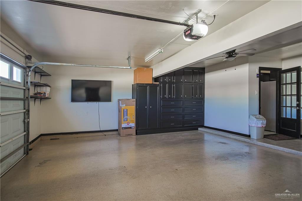 412 Toronto Avenue, Unit 34 McAllen, TX 78503 - Photo 35 of 44 Garage featuring a garage door opener and ceiling fan