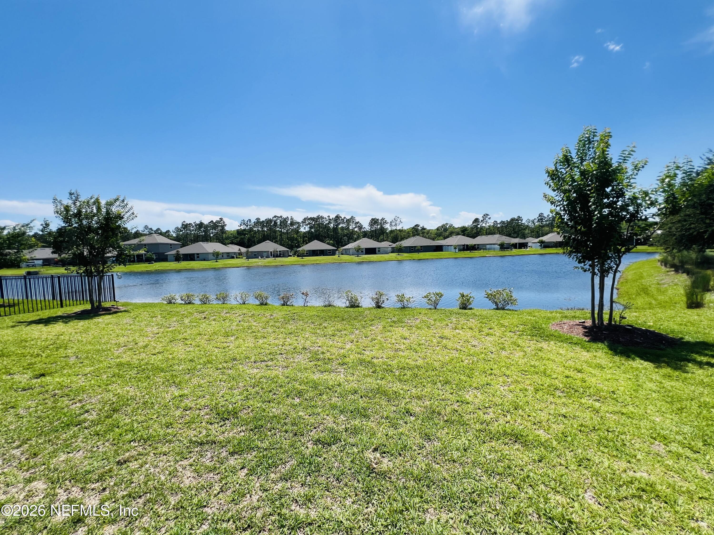 2 Rivertown Road Palm Coast, FL 32137 - Photo 8 of 80 a view of a lake with houses in the background