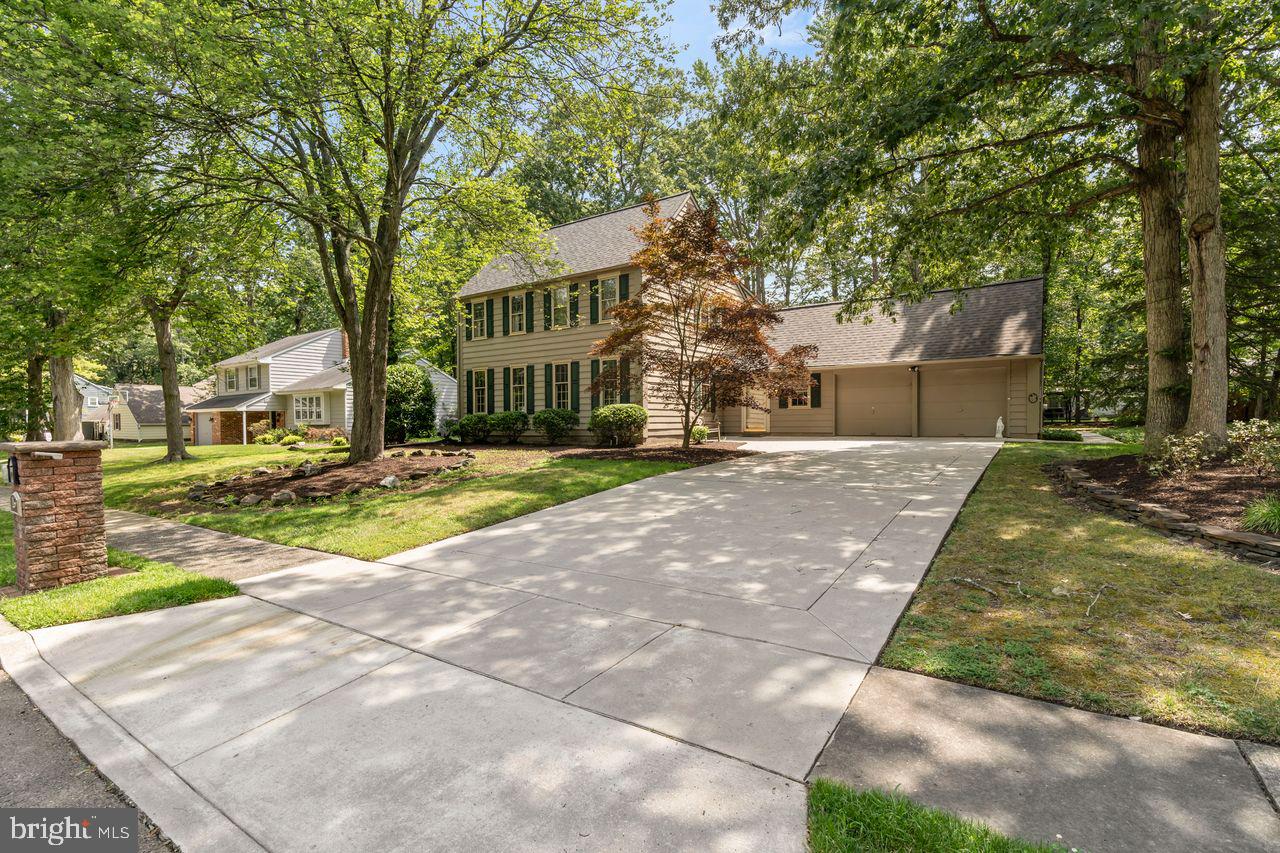 a pathway of a house with a yard