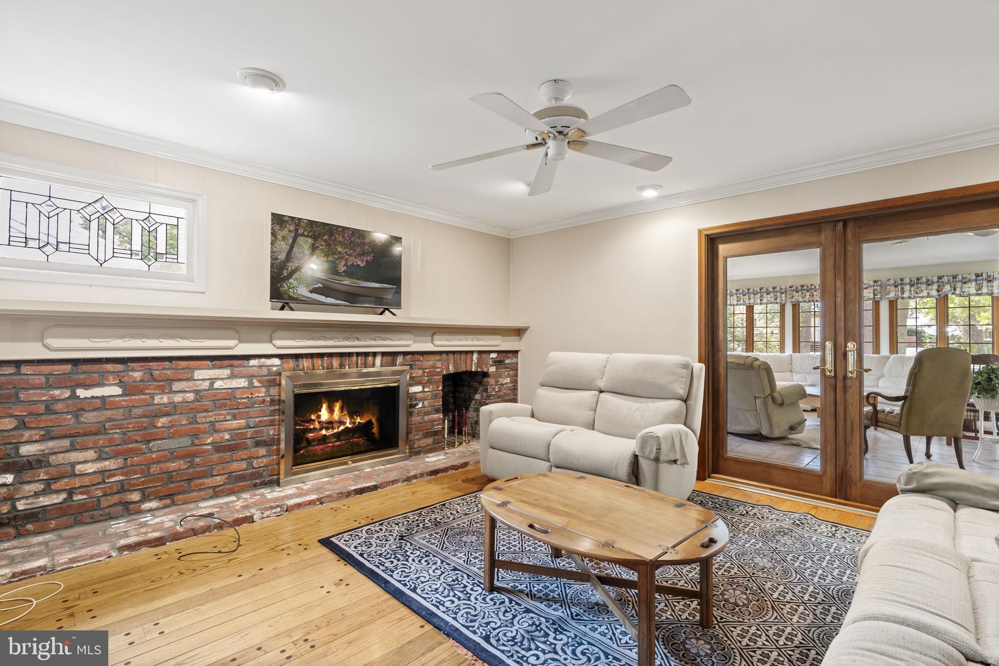 16 Whitby Road Cherry Hill, NJ 08003 - Photo 14 of 28 a living room with furniture and a fireplace