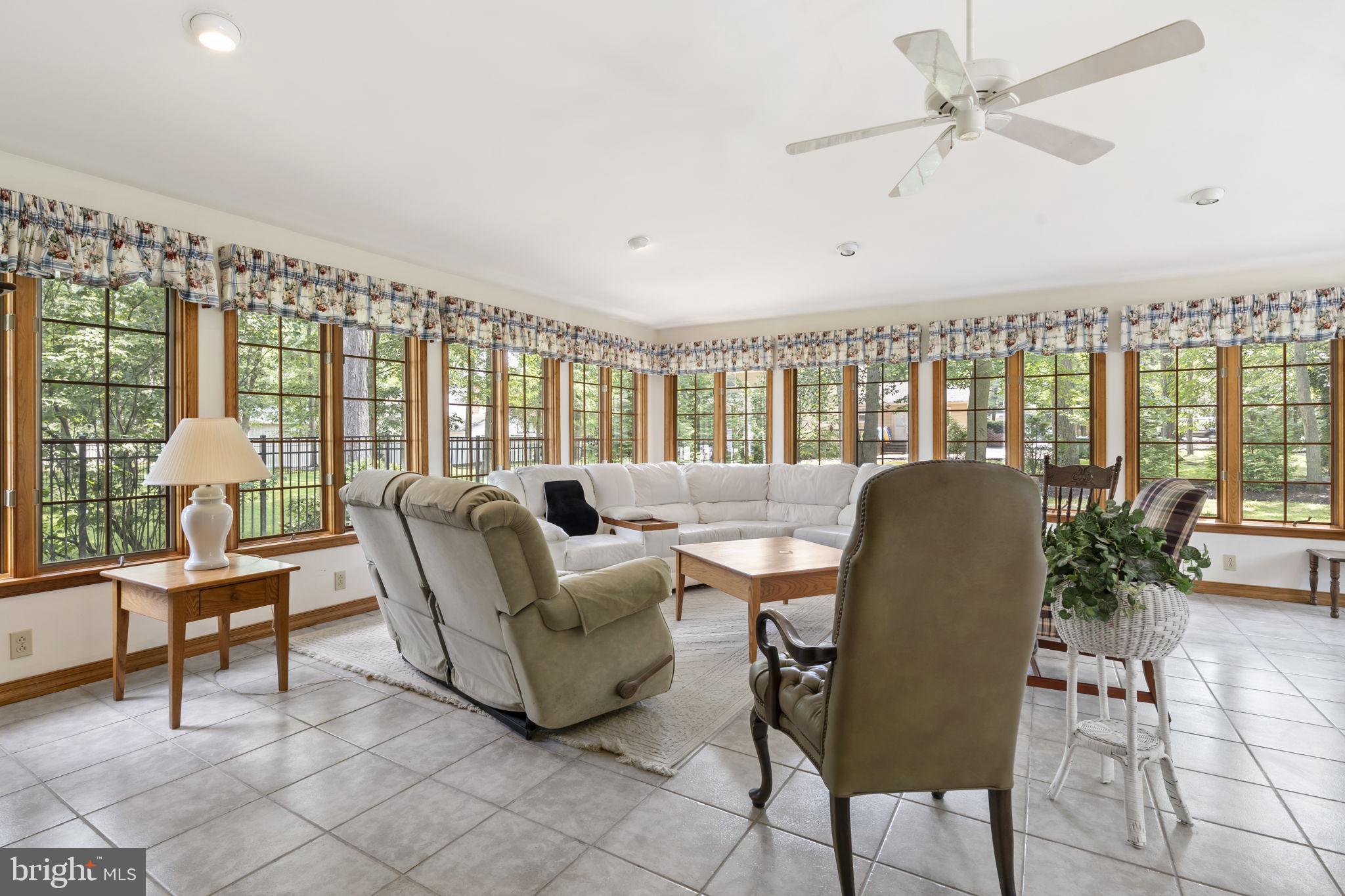 16 Whitby Road Cherry Hill, NJ 08003 - Photo 16 of 28 a living room with furniture and a large window