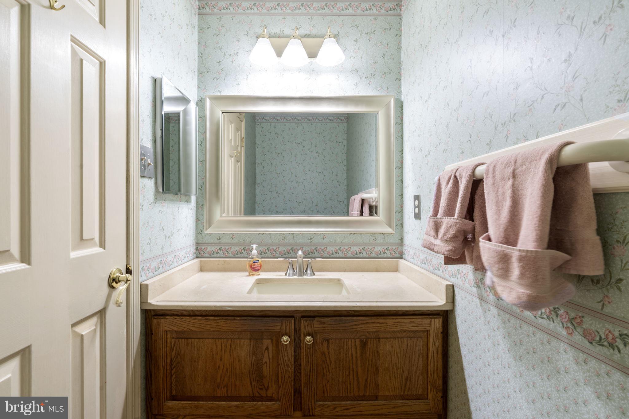 16 Whitby Road Cherry Hill, NJ 08003 - Photo 19 of 28 a bathroom with a sink and a mirror