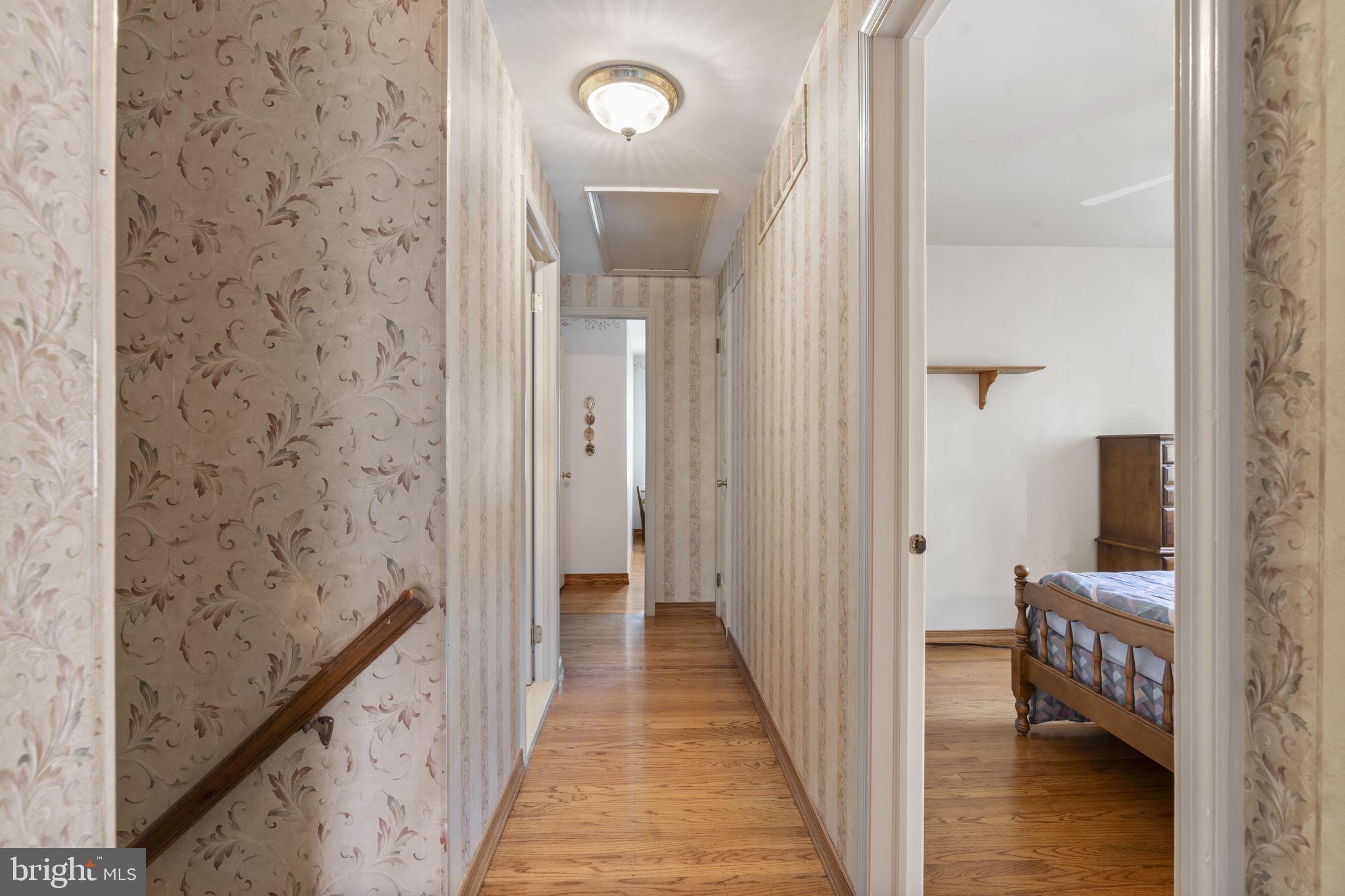 16 Whitby Road Cherry Hill, NJ 08003 - Photo 20 of 28 a view of a hallway with wooden floor and staircase