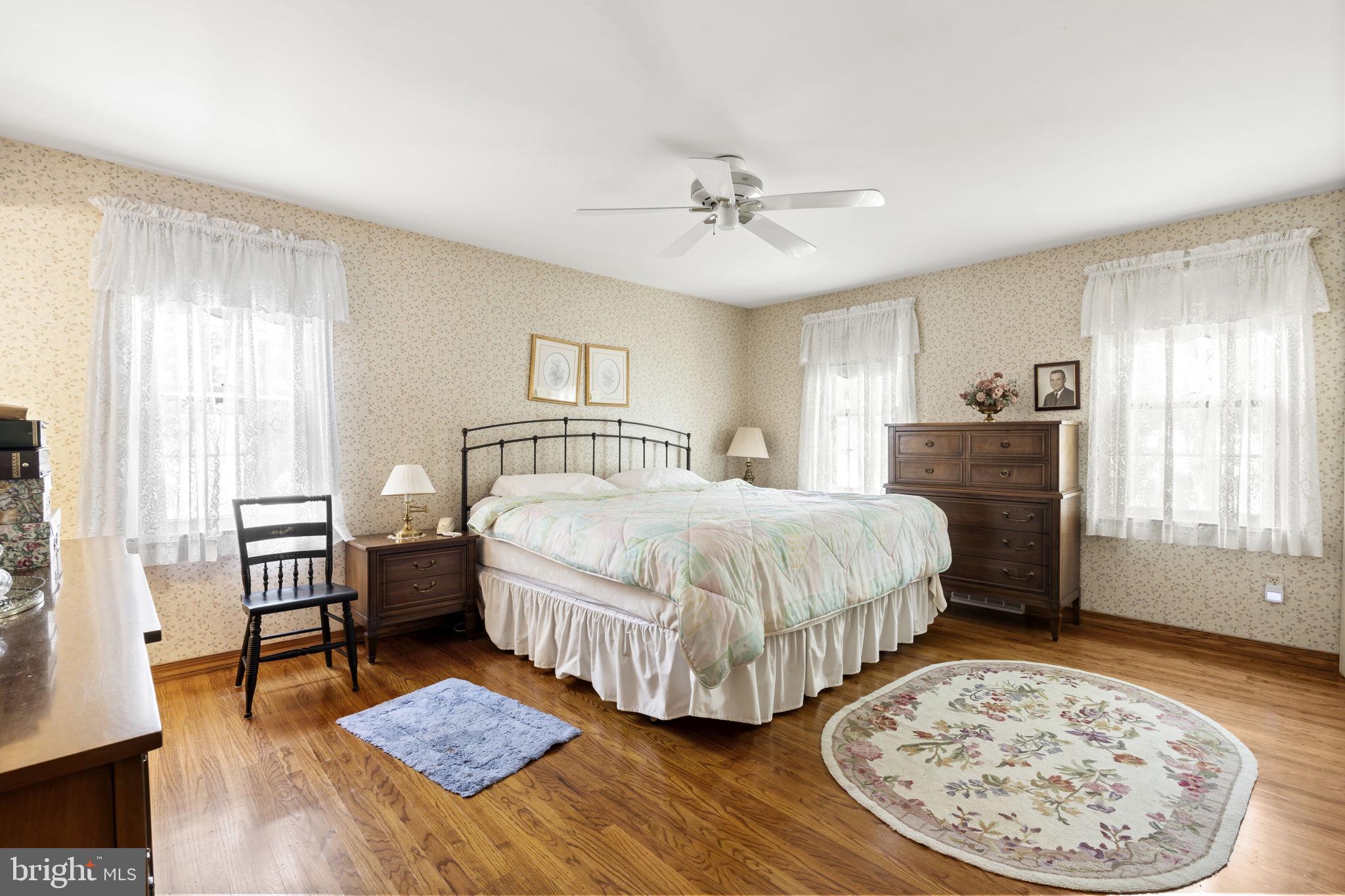 16 Whitby Road Cherry Hill, NJ 08003 - Photo 25 of 28 a spacious bedroom with a bed a dresser and wooden floor
