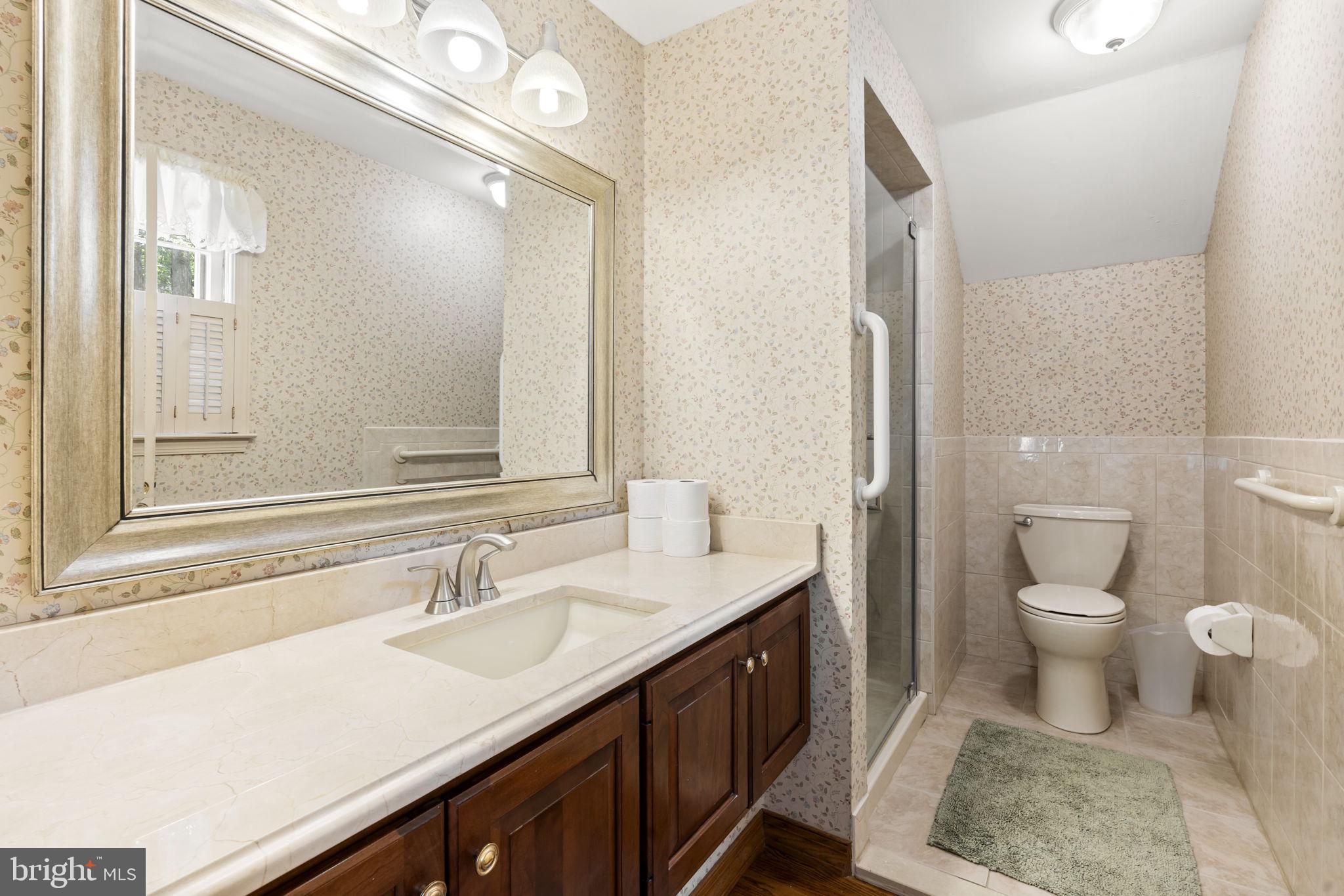 16 Whitby Road Cherry Hill, NJ 08003 - Photo 26 of 28 a bathroom with a sink and a mirror