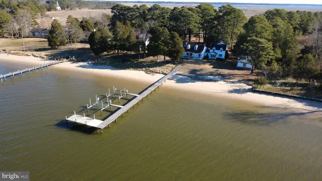 a view of a lake with a car parked on the road