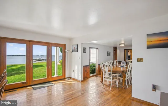 a view of a livingroom with furniture window and wooden floor