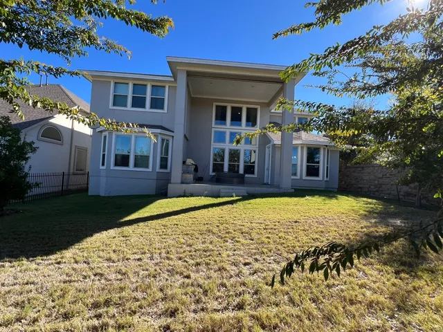 a kitchen with stainless steel appliances granite countertop a stove and a microwave