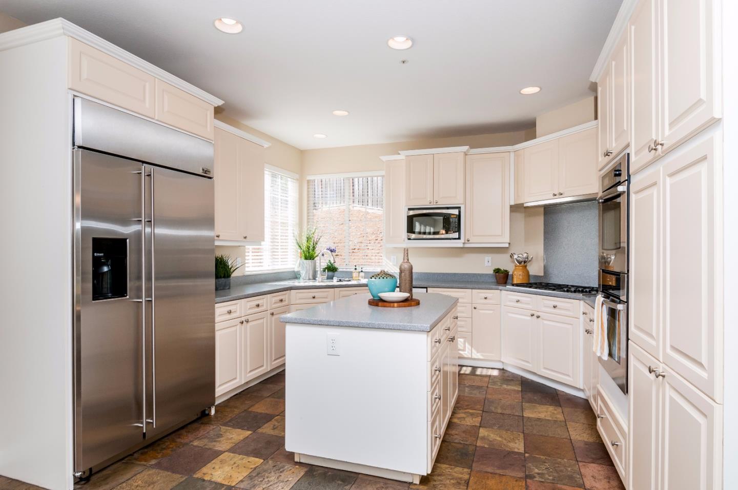 1 Ralston Ranch Road Belmont, CA 94002 - Photo 8 of 27 a kitchen with stainless steel appliances granite countertop a refrigerator sink stove microwave and cabinets