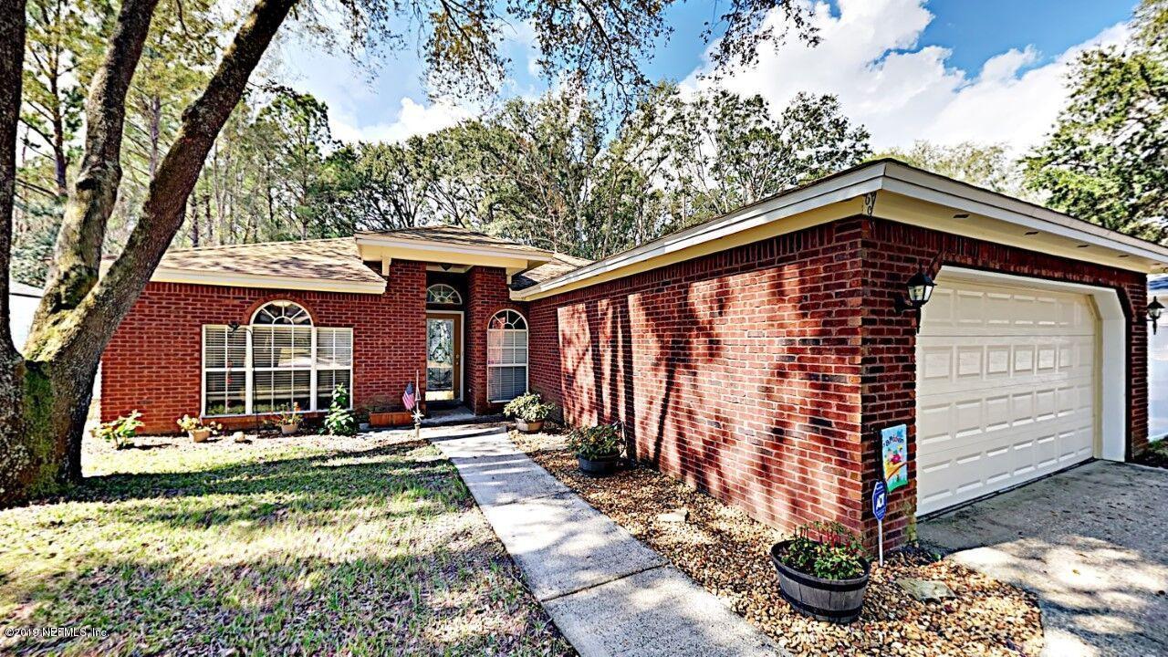 12830 Moose Road Jacksonville, FL 32226 - Photo 1 of 31 a view of a house with backyard and sitting area