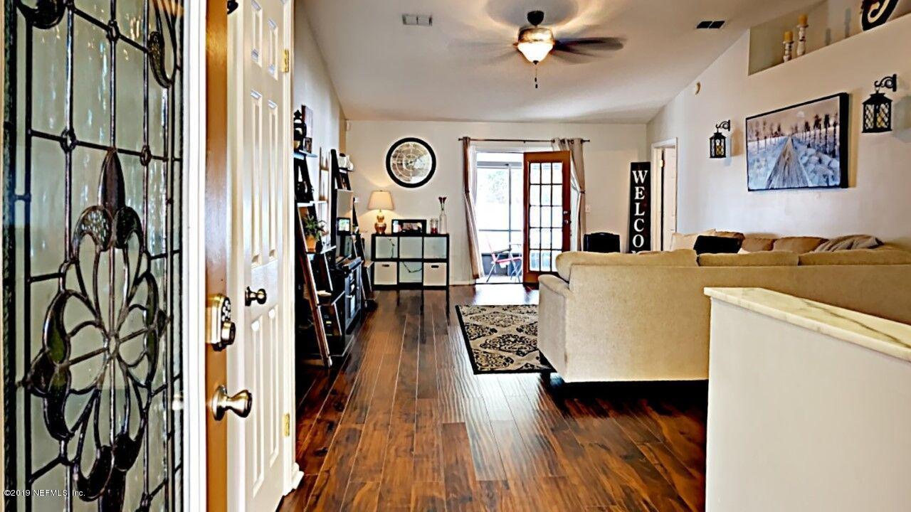 12830 Moose Road Jacksonville, FL 32226 - Photo 2 of 31 a living room with furniture and a window