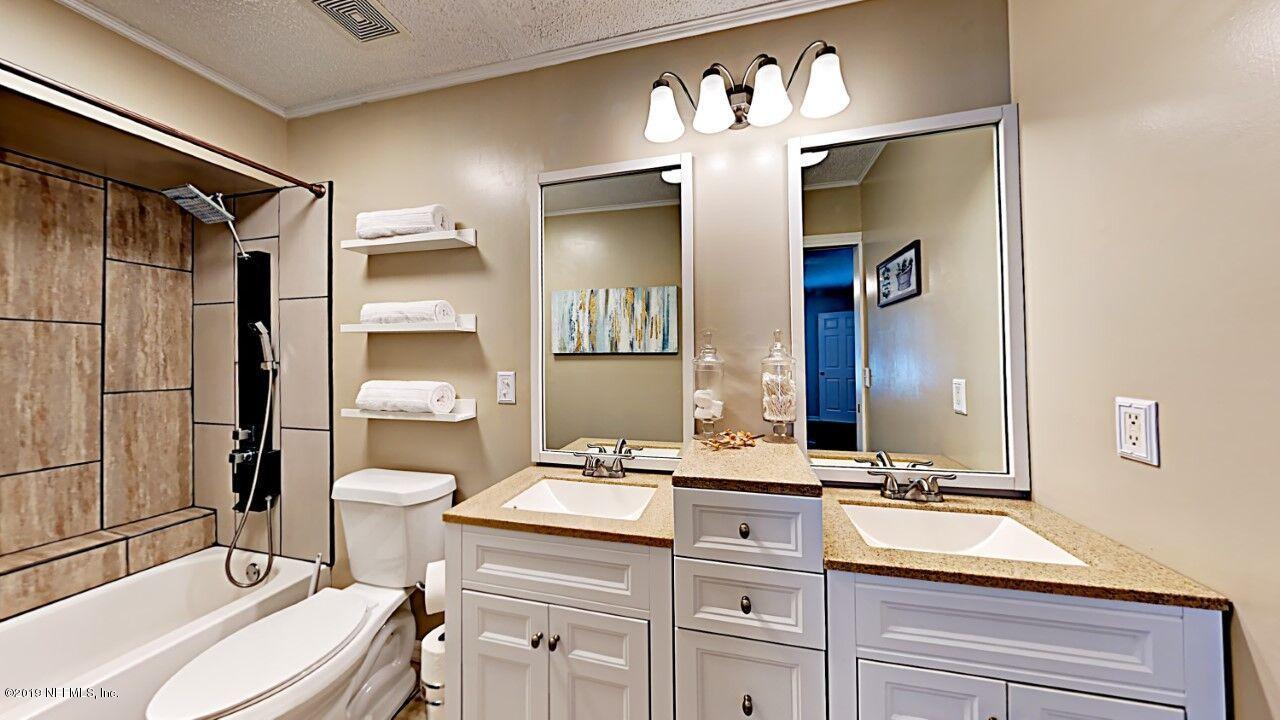 12830 Moose Road Jacksonville, FL 32226 - Photo 21 of 31 a bathroom with a sink a toilet and shower