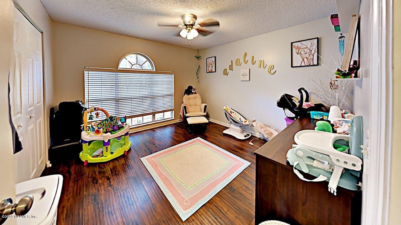 12830 Moose Road Jacksonville, FL 32226 - Photo 22 of 31 a living room filled with furniture