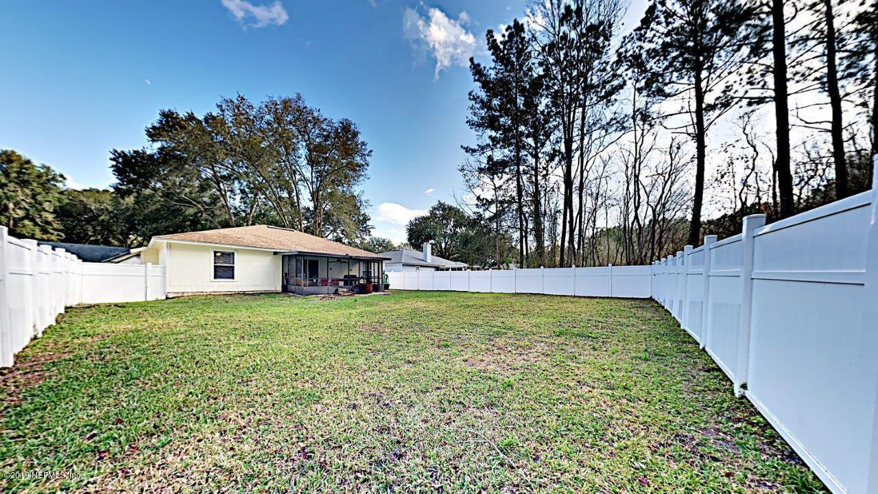 12830 Moose Road Jacksonville, FL 32226 - Photo 31 of 31 a view of a house with a yard