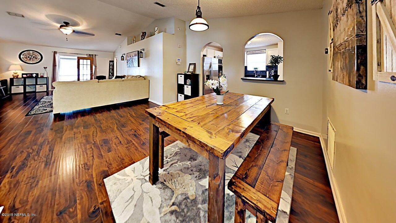12830 Moose Road Jacksonville, FL 32226 - Photo 5 of 31 a view of a living room and dining room