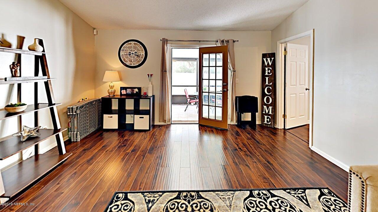 12830 Moose Road Jacksonville, FL 32226 - Photo 8 of 31 an entryway with wooden floor