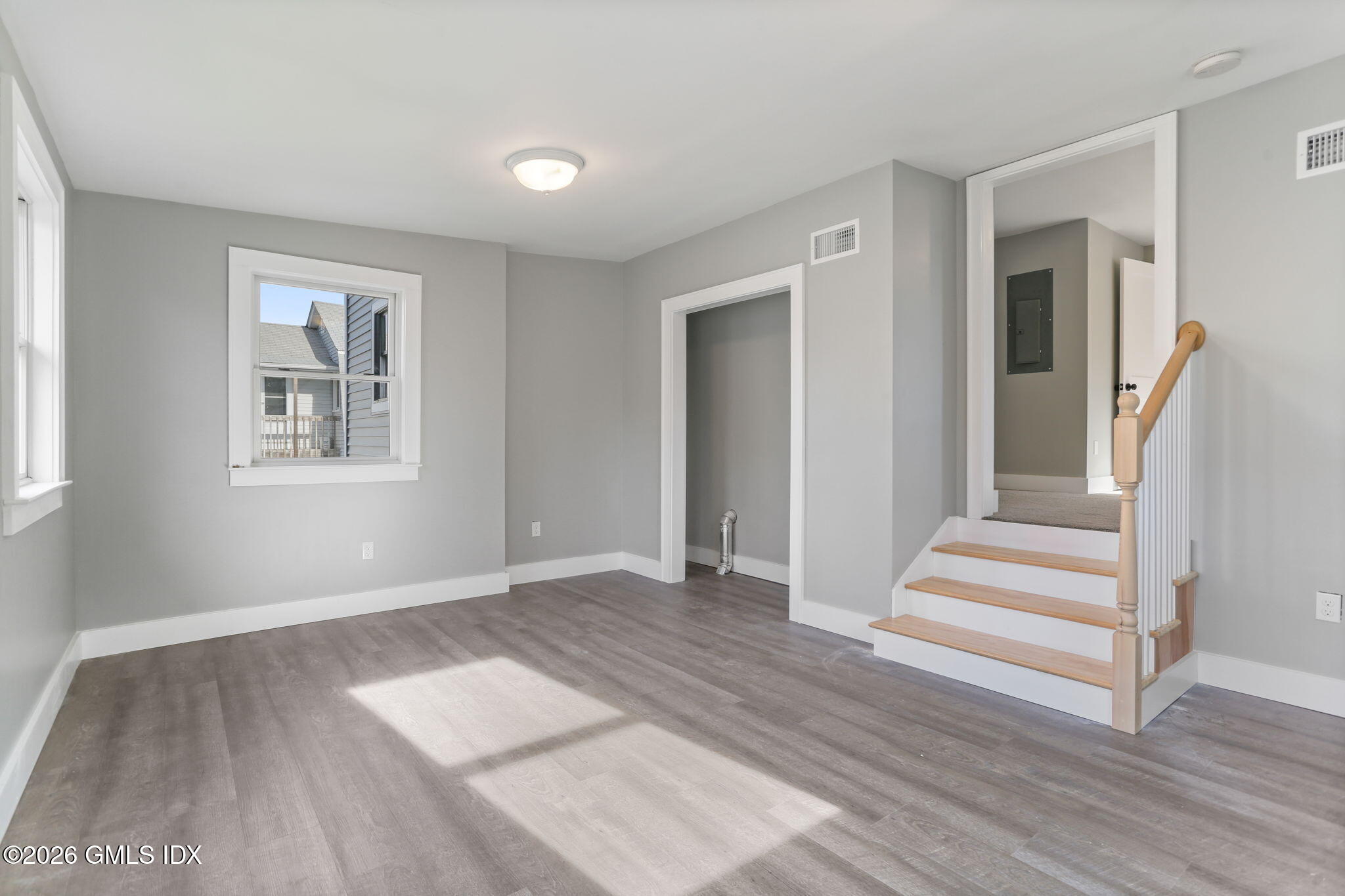35 Euclid Avenue, Unit B Stamford, CT 06902 - Photo 18 of 27 a view of an empty room with wooden floor and a window