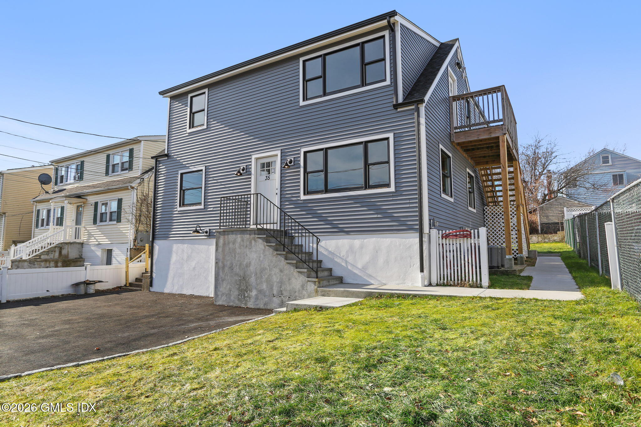 35 Euclid Avenue, Unit B Stamford, CT 06902 - Photo 25 of 27 a front view of a house with a yard