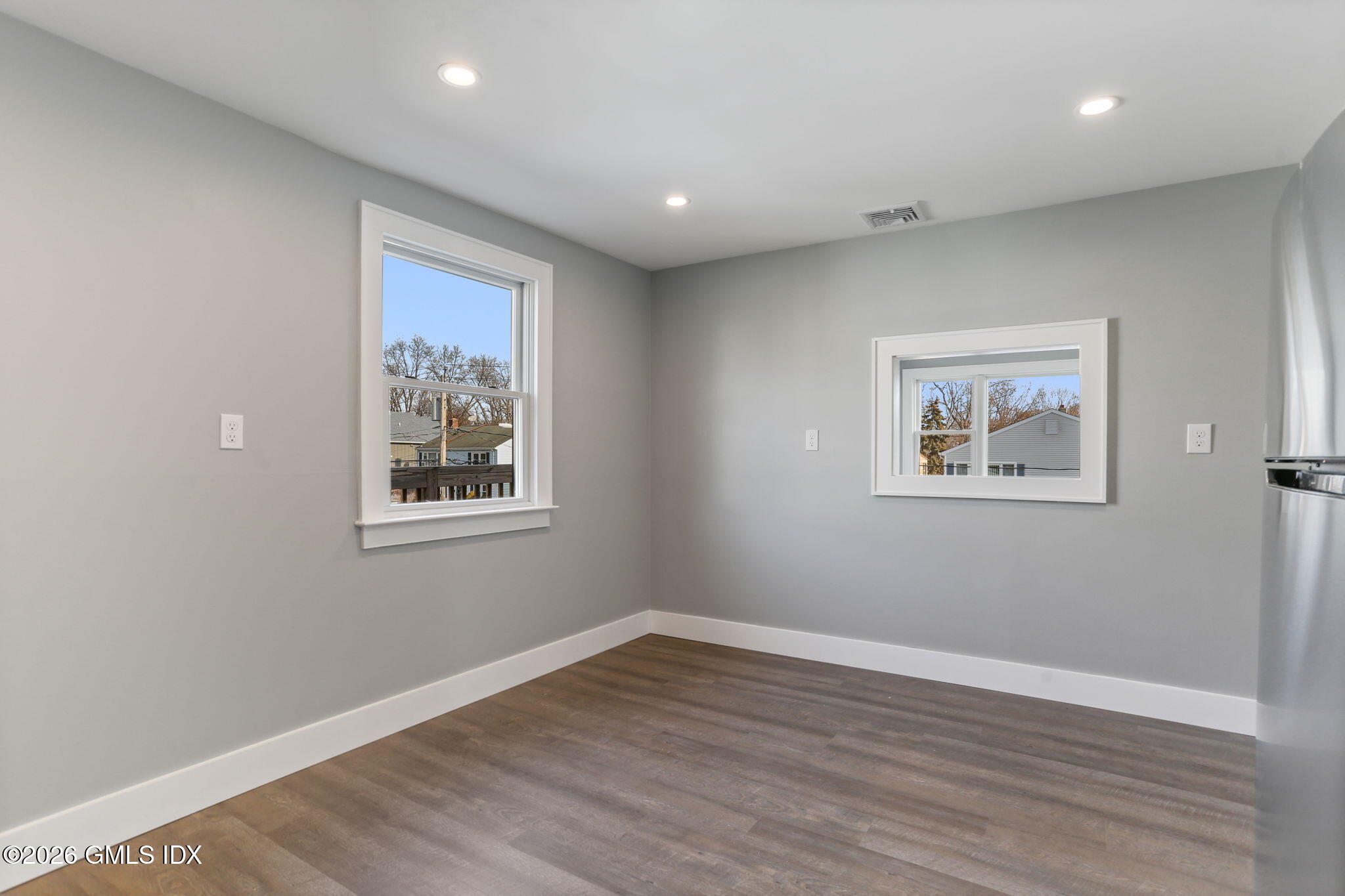 35 Euclid Avenue, Unit B Stamford, CT 06902 - Photo 10 of 27 a view of a big room with wooden floor and windows