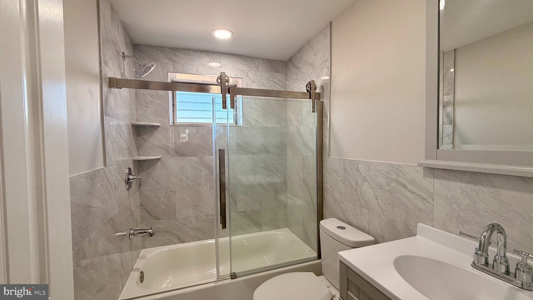 7219 Saul Street Philadelphia, PA 19149 - Photo 12 of 24 a bathroom with a shower and a toilet sink