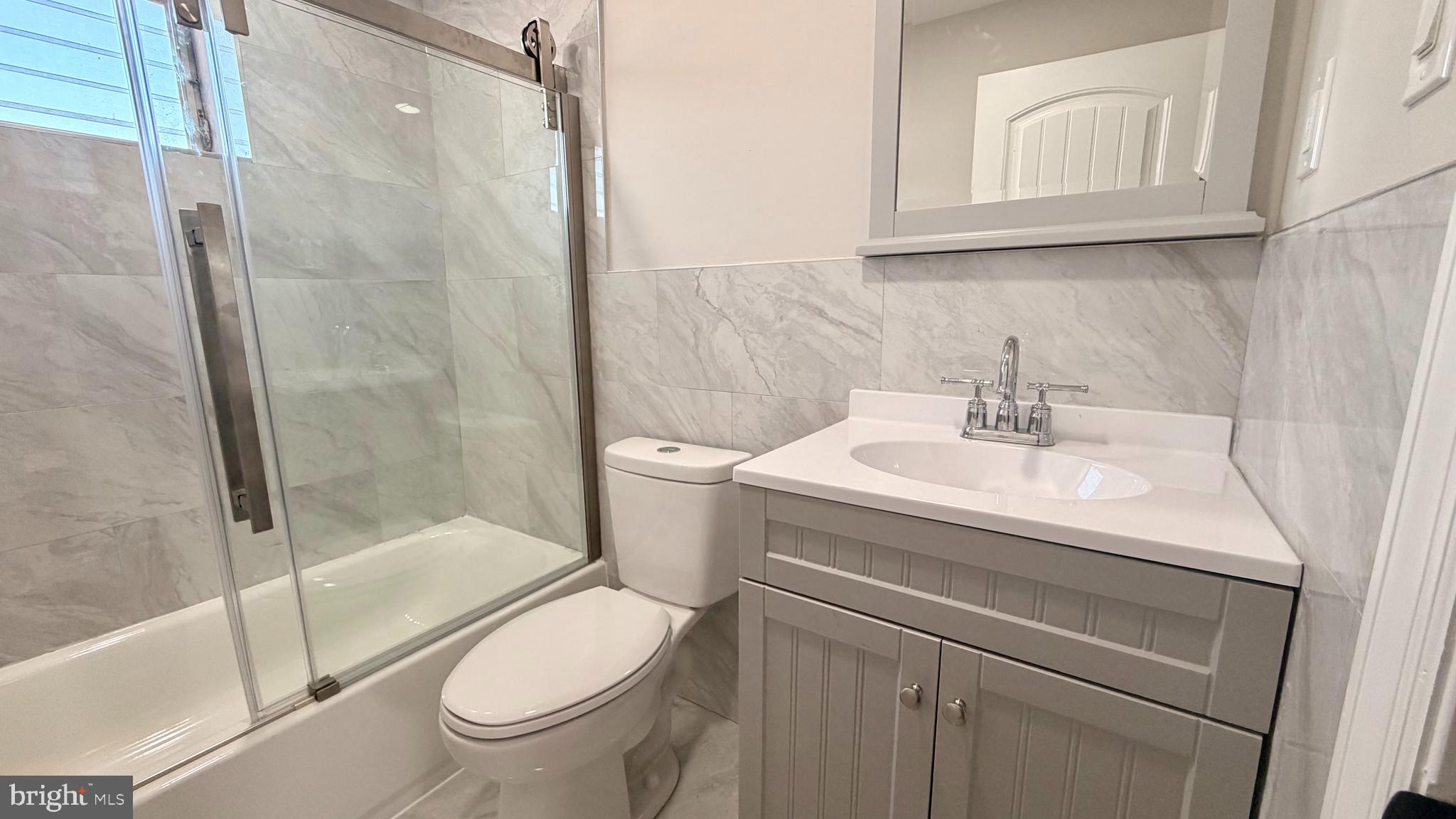 7219 Saul Street Philadelphia, PA 19149 - Photo 14 of 24 a bathroom with a sink toilet and shower