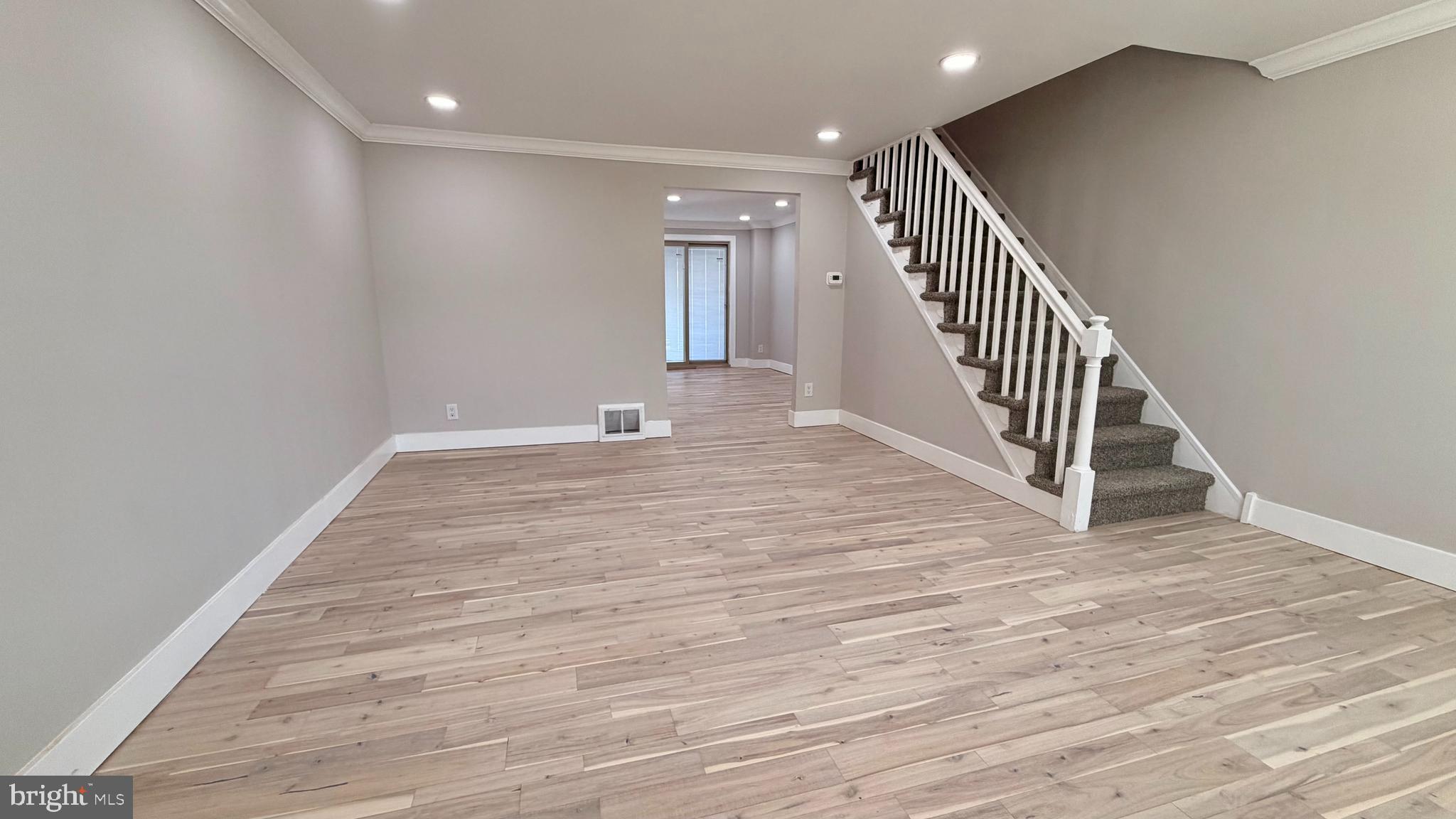 7219 Saul Street Philadelphia, PA 19149 - Photo 2 of 24 a view of a hallway with wooden floor and entryway