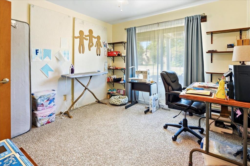 12657 Alma Street Tyler, TX 75704 - Photo 19 of 36 a view of a workspace with furniture and a window