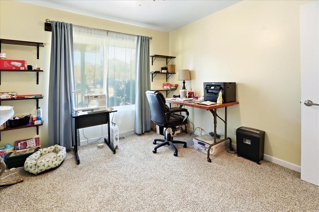 12657 Alma Street Tyler, TX 75704 - Photo 20 of 36 a view of a workspace with furniture and a window