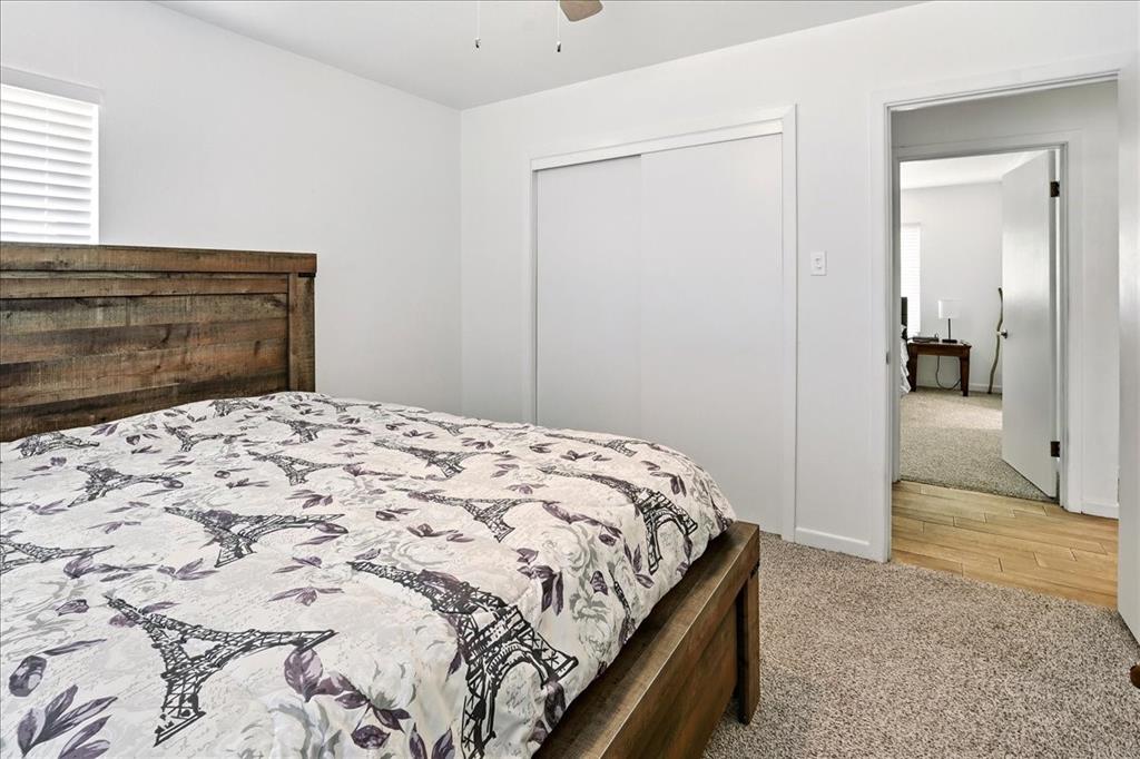 12657 Alma Street Tyler, TX 75704 - Photo 22 of 36 a bedroom with a bed and a mirror